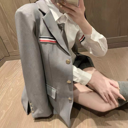 Metal-buttoned suit