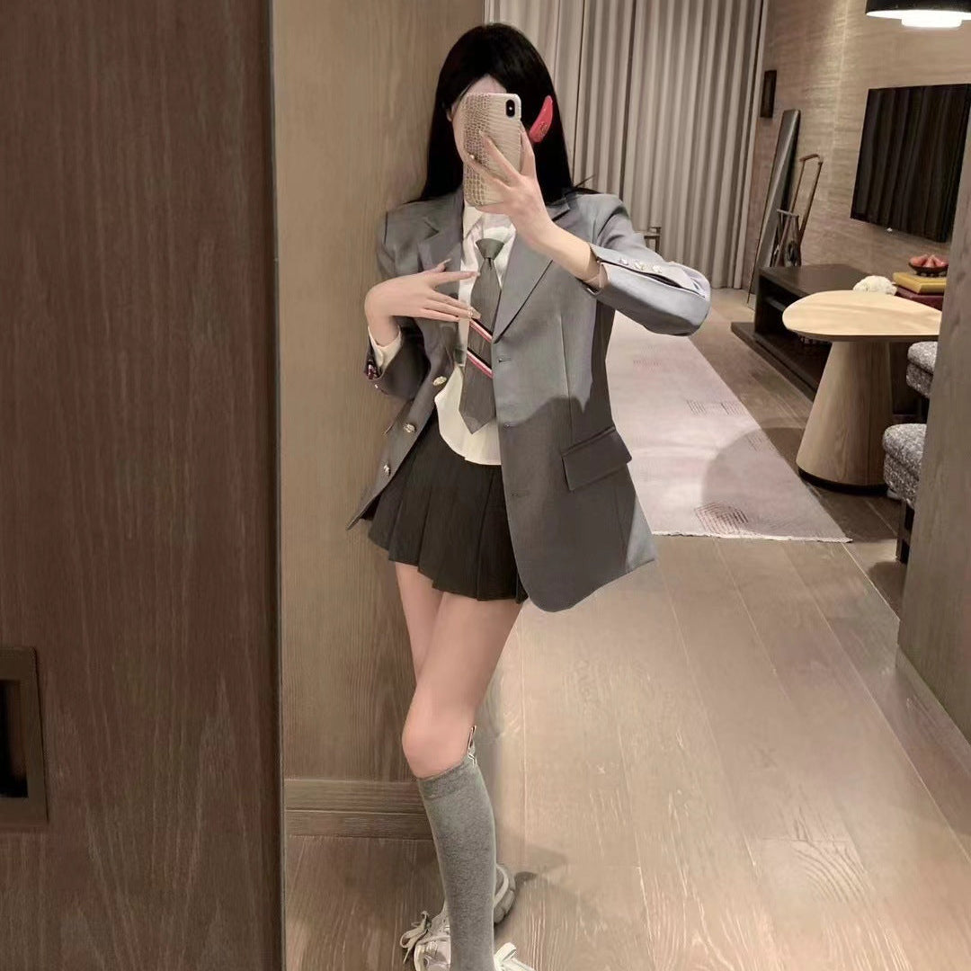 Metal-buttoned suit