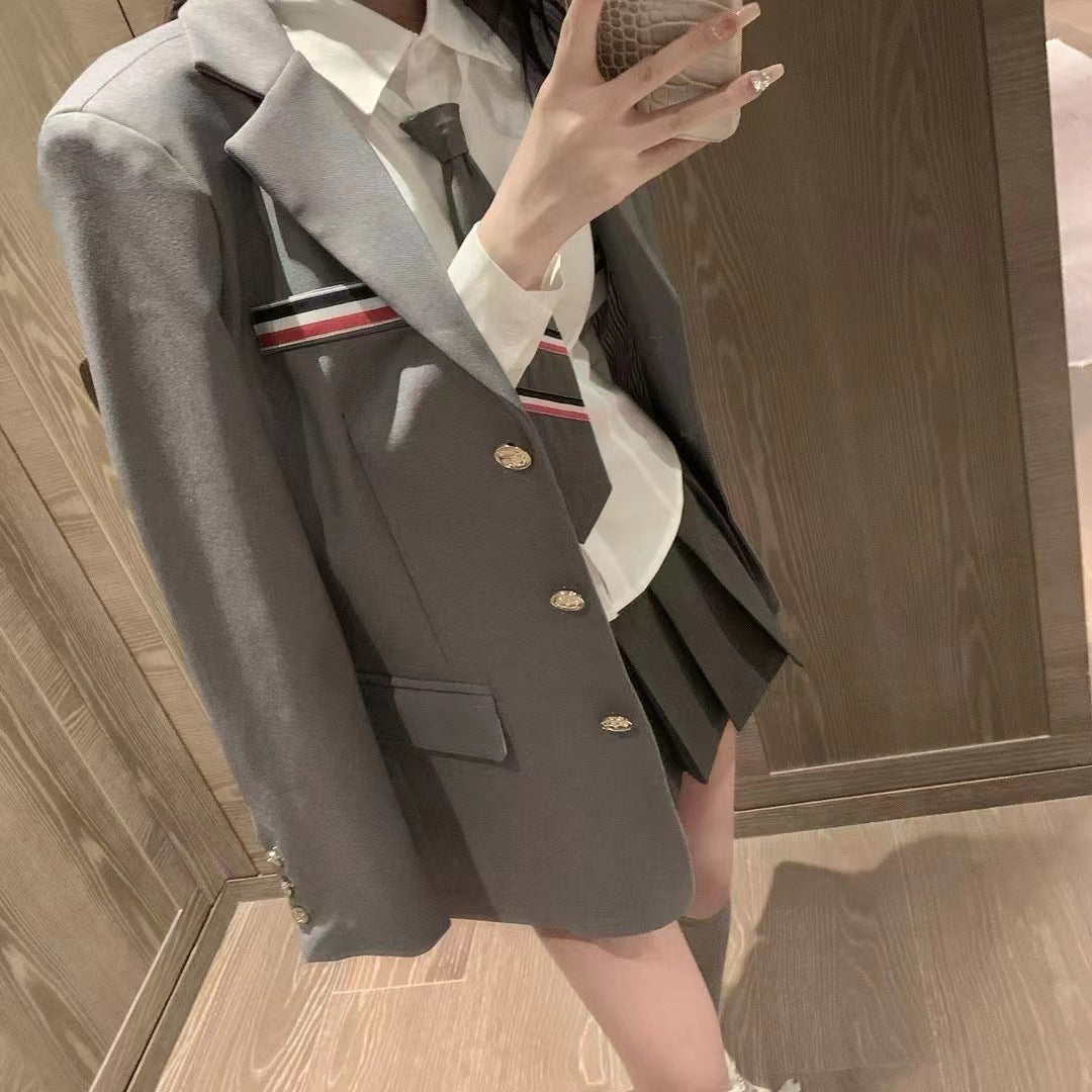 Metal-buttoned suit