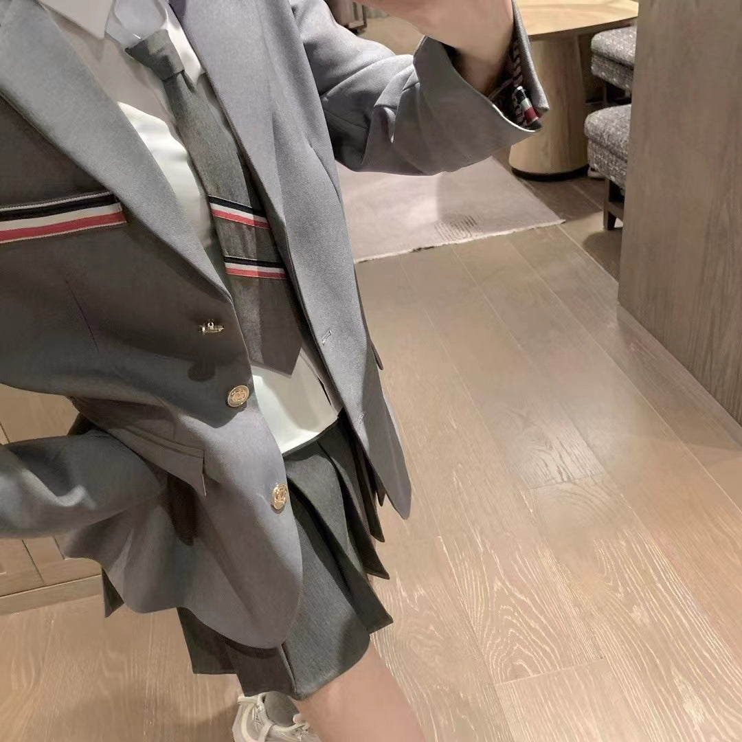 Metal-buttoned suit