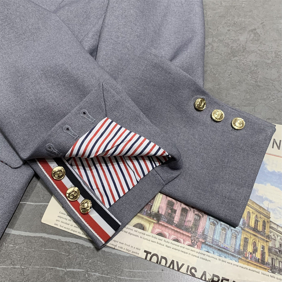 Metal-buttoned suit