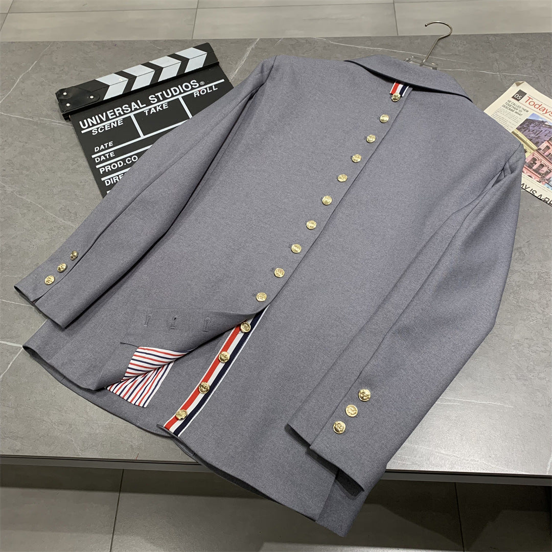 Metal-buttoned suit